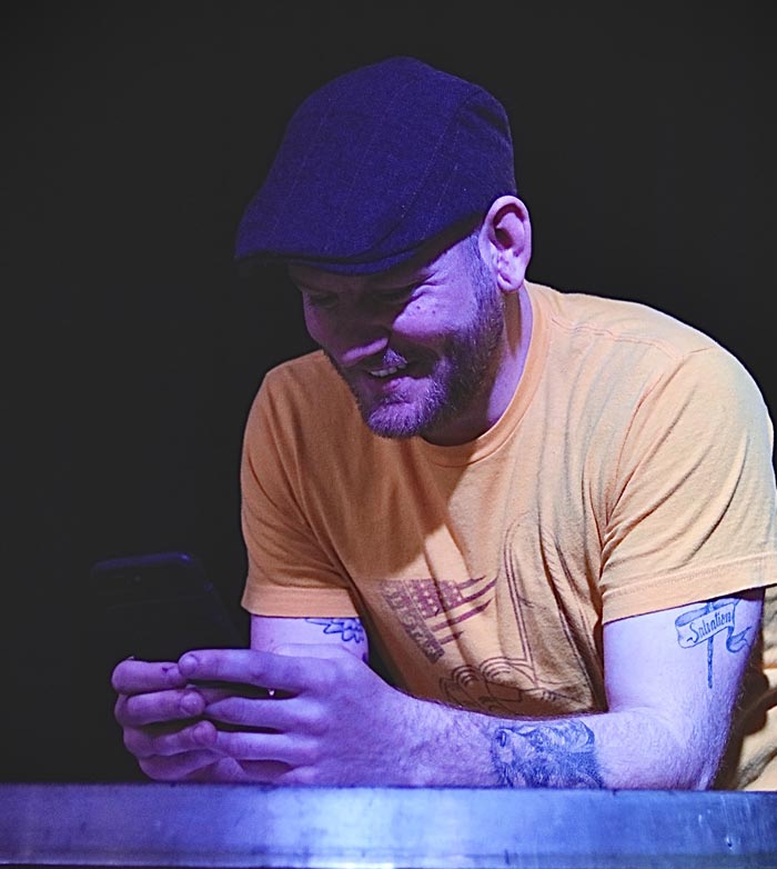 smiling man looking at phone